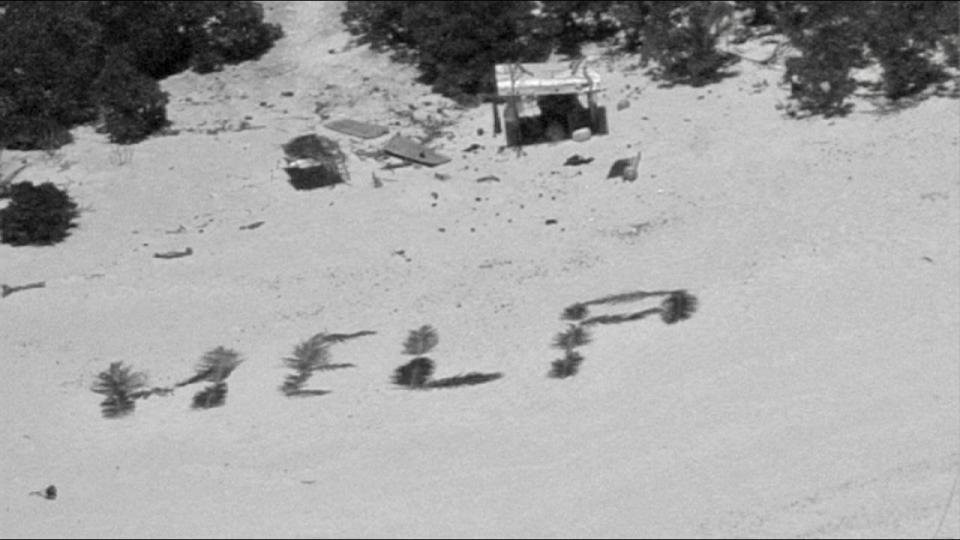 The crew of a Hawaii-based HC-130J Hercules aircraft makes contact with three mariners stranded on Pikelot Atoll, Yap State, Federated States of Micronesia, after dropping them a radio on April 8, 2024.  / Credit: U.S. Coast Guard photo