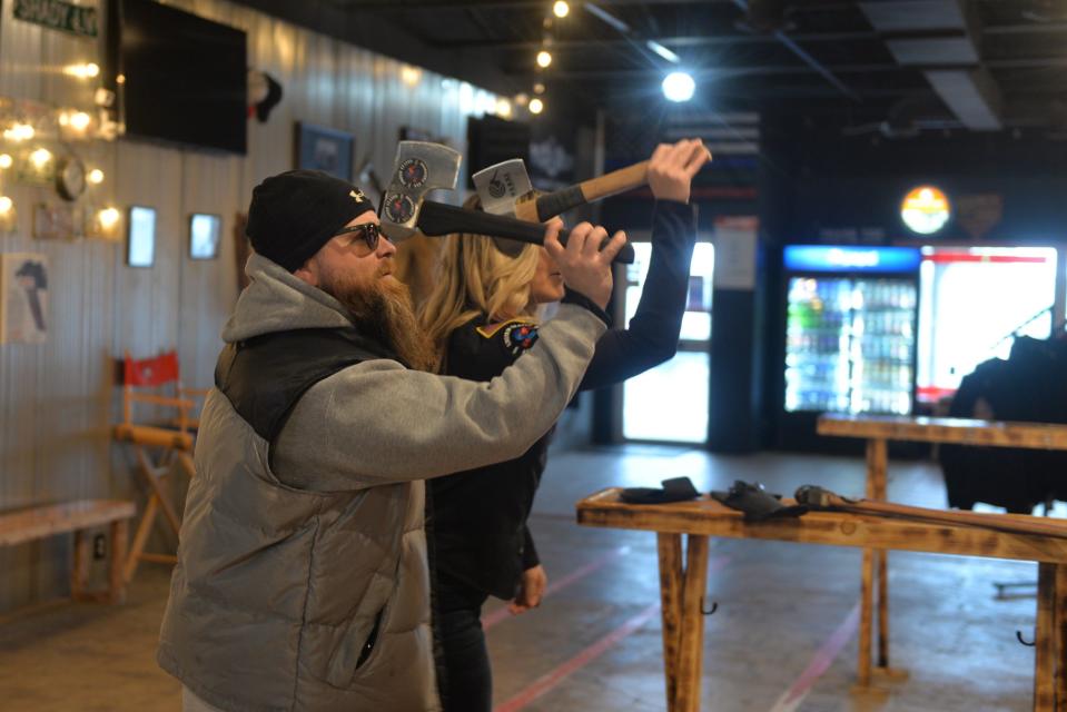 Dustin and Niki Knight practice their duals throwing Thursday, Nov. 17, 2022.