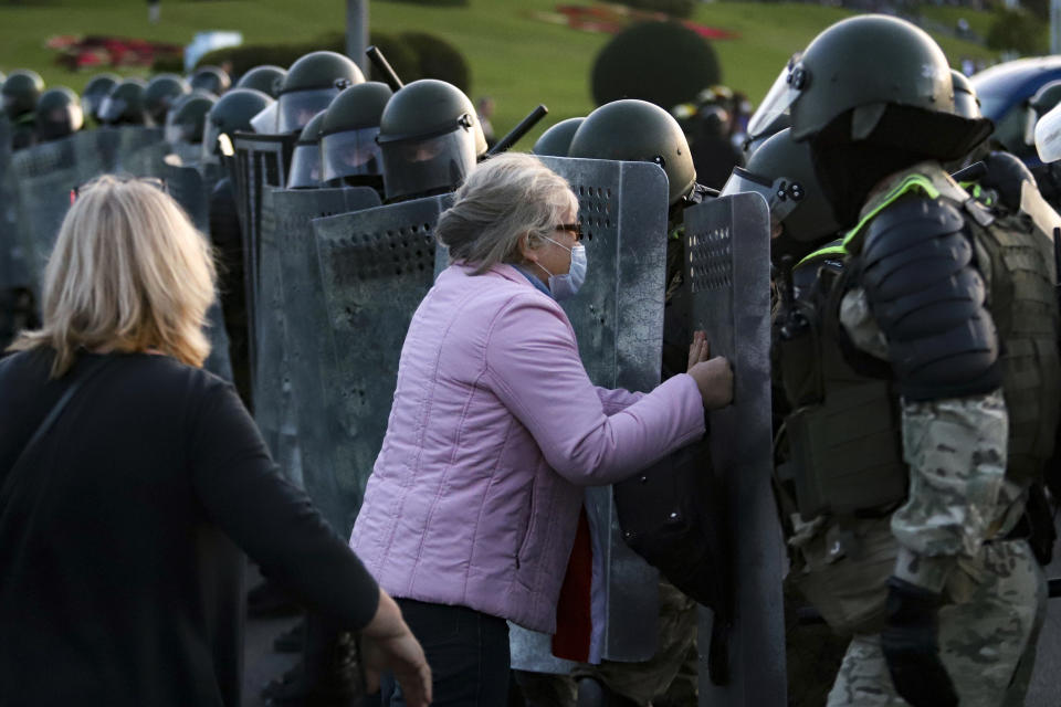 A woman argues with riot police during an opposition rally to protest the presidential inauguration in Minsk, Belarus, Wednesday, Sept. 23, 2020. Belarus President Alexander Lukashenko has been sworn in to his sixth term in office at an inaugural ceremony that was not announced in advance amid weeks of huge protests saying the authoritarian leader's reelection was rigged. Hundreds took to the streets in several cities in the evening to protest the inauguration. (AP Photo)