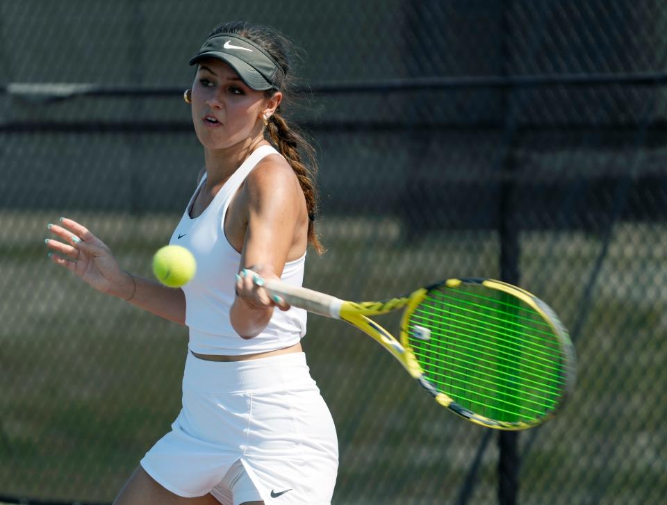 Spruce Creek's Melissa Perman hits a forehand return during Region 1-4A finals at Spruce Creek High School in Port Orange, Thursday, April 25, 2024.