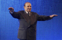 FILE - In this Feb.12 2009, file photo, Algerian President Abdelaziz Bouteflika waves during a rally in Algiers. Former Algerian President Bouteflika, who fought for independence from France in the 1950s and 1960s and was ousted amid pro-democracy protests in 2019 after 20 years in power, has died at age 84, state television announced Friday, Sept. 17, 2021. (AP Photo/Sidali Djarboub, File)
