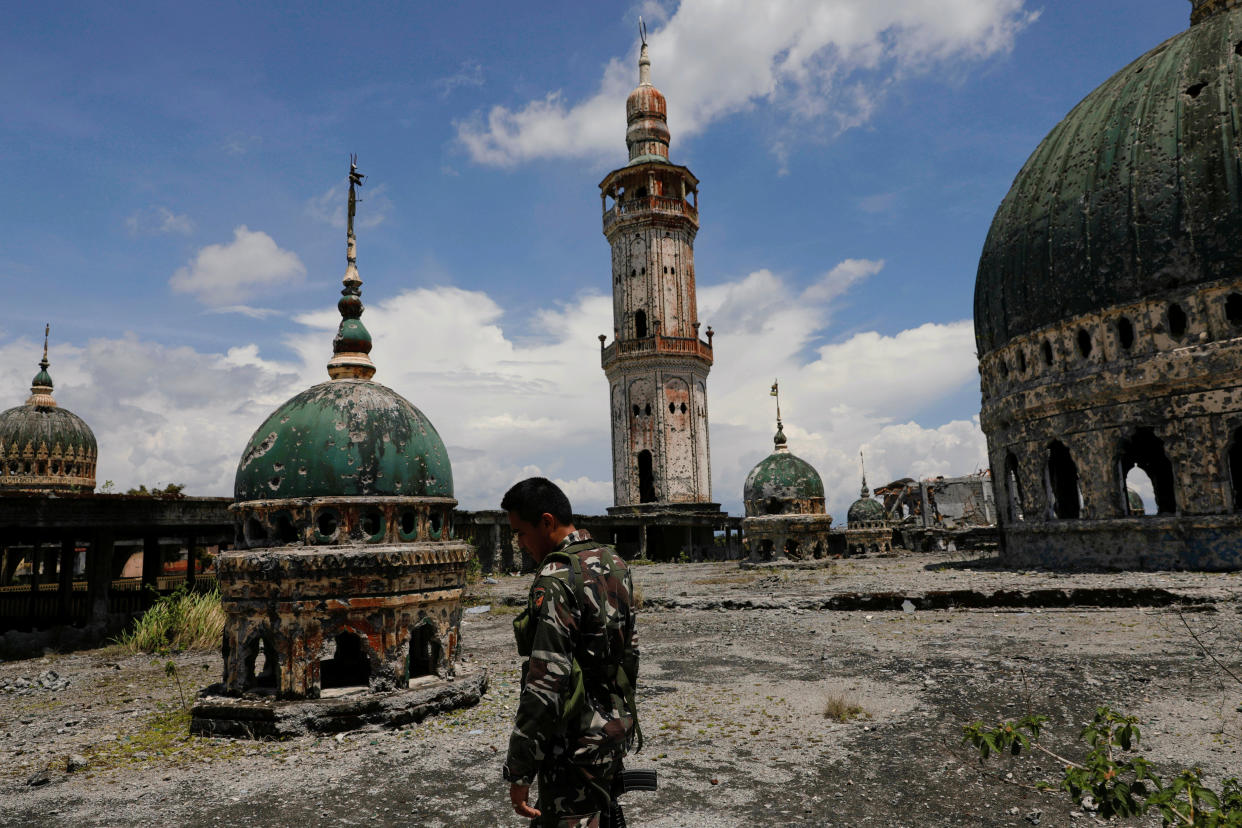 A soldier walks on the rooftop of the war-torn Grand Mosque in Marawi City, Lanao del Sur province, Philippines. (Photo: Eloisa Lopez/Reuters)