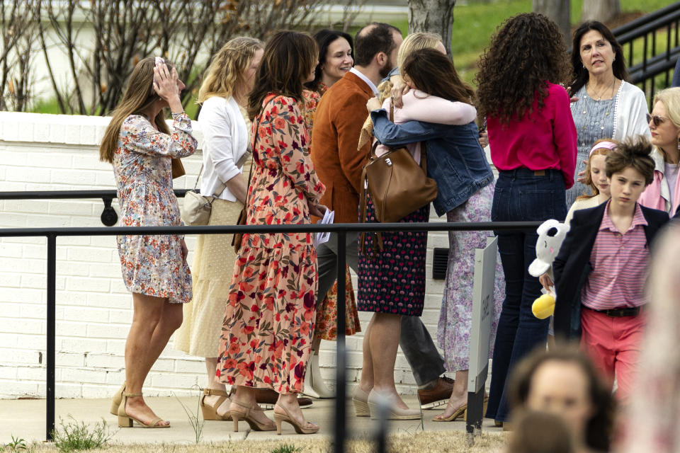 Mourners embrace after a funeral service held for The Covenant School shooting victim Evelyn Dieckhaus at the Woodmont Christian Church Friday, March 31, 2023, in Nashville, Tenn. (AP Photo/Wade Payne)