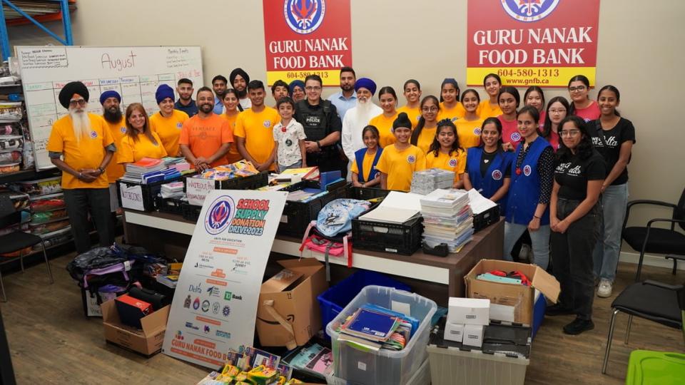 Walia, third from left, in a handout photo from the weekend's kickoff to the school supply drive. Walia said the drive has gathered a large amount of a variety of items which will be sent to the Delta and Surrey school districts for distribution to kids in need.                               