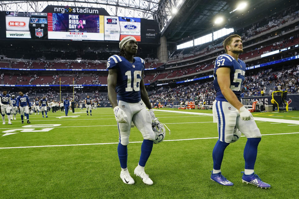 Indianapolis Colts wide receiver Ashton Dulin (16) and teammate linebacker JoJo Domann (57) leave the field after their overtime tie with the Houston Texans after an NFL football game Sunday, Sept. 11, 2022, in Houston. (AP Photo/David J. Phillip)