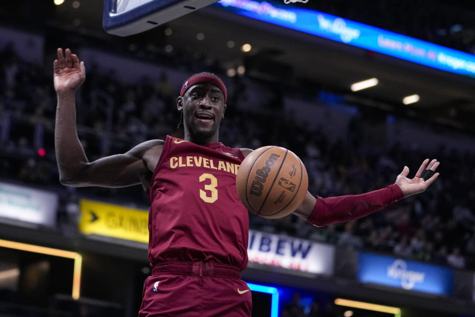 Cleveland Cavaliers guard Caris LeVert (3) follows through on a dunk against the Indiana Pacers during the first half of an NBA basketball game in Indianapolis, Monday, March 18, 2024. (AP Photo/Michael Conroy)