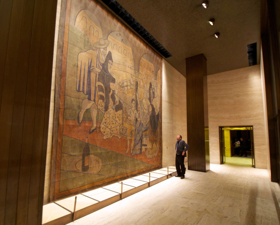 In this Feb. 28, 2014 photo provided by the New York Landmarks Conservancy, a stage curtain painted by Pablo Picasso hangs on a wall at the Four Seasons restaurant in New York. Plans to move the 1919 canvas from the Four Seasons has touched off a dispute between a prominent preservation group against an art-loving real estate magnate. (AP Photo/New York Landmarks Conservancy, Rick Bruner)