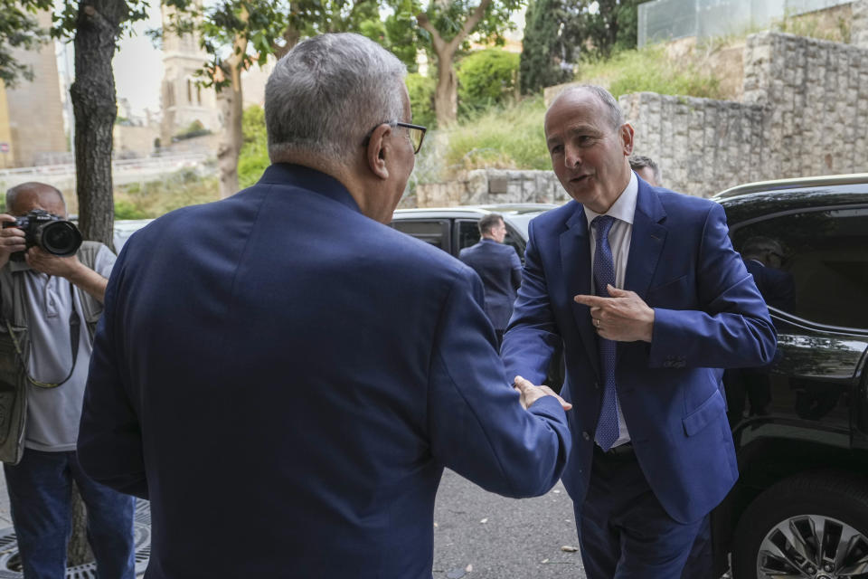 Lebanese Foreign Minister Abdallah Bouhabib, left, shakes hands with Ireland's Deputy Prime Minister and Foreign Minister Micheal Martin before their meeting in Beirut, Lebanon, Monday, May 20, 2024. (AP Photo/Hassan Ammar)