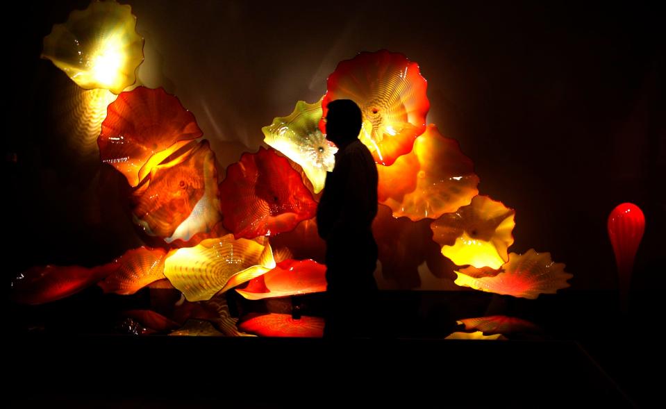 A visitor walks past the Dale Chihuly exhibit during family day at the Oklahoma City Museum of Art, Sunday, April 13, 2014.