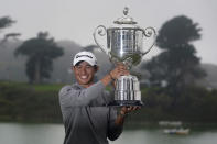 Collin Morikawa holds the Wanamaker Trophy after winning the PGA Championship golf tournament at TPC Harding Park Sunday, Aug. 9, 2020, in San Francisco. (AP Photo/Jeff Chiu)