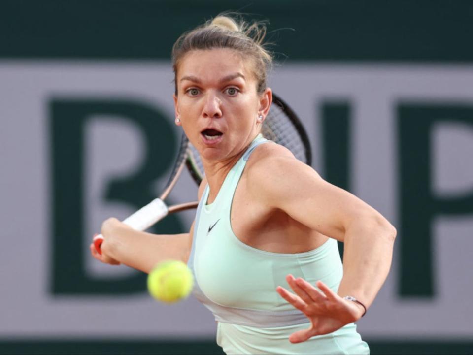 Simona Halep in action at Roland Garros (AFP via Getty Images)