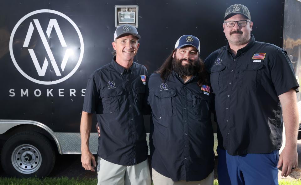 M/W Smokers team members, Brian Cox, from left, Brian Wynn and Brandon Massey have launched the Meat Whiskey line of BBQ sauce and dry rubs after honing their skills competing at the Memphis in May World Championship Barbecue Cooking Contest.