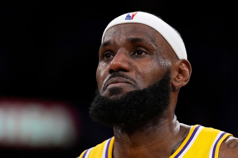 Los Angeles Lakers forward LeBron James appears to tear up after passing Kareem Abdul-Jabbar to become the NBA's all-time leading scorer during the second half of an NBA basketball game against the Oklahoma City Thunder Tuesday, Feb. 7, 2023, in Los Angeles. (AP Photo/Ashley Landis)