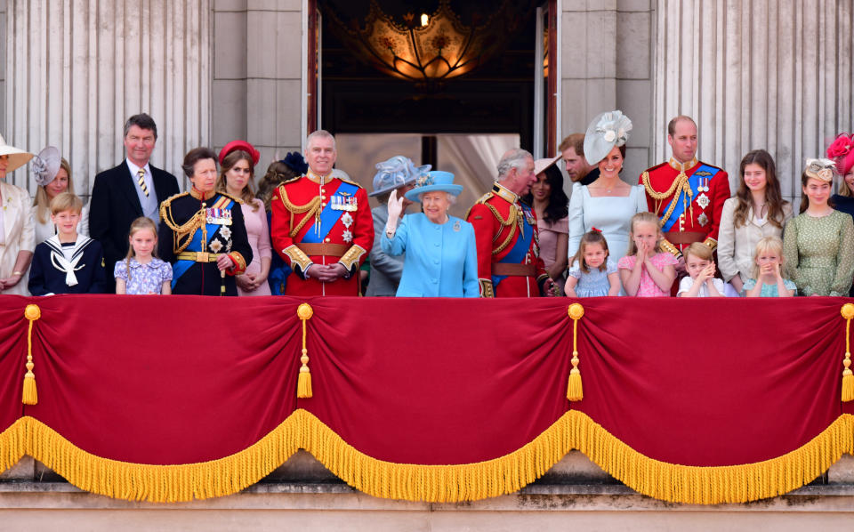  Vice Admiral Sir Tim Laurence, Princess Anne, Princess Royal, Princess Beatrice, Prince Andrew, Duke of York, Camilla, Duchess Of Cornwall, Queen Elizabeth II, Prince Charles, Prince of Wales, Meghan, Duchess of Sussex, Prince Harry, Duke of Sussex, Catherine, Duchess of Cambridge, Prince William, Duke of Cambridge, Princess Charlotte of Cambridge, Savannah Phillips, Prince George of Cambridge and Isla Phillips stand on the balcony of Buckingham Palace during the Trooping the Colour parade on June 9, 2018 in London, England.