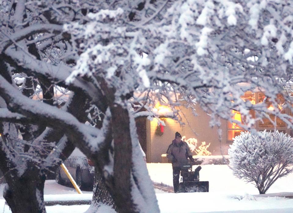 Nate Tomczuk clears his driveway in Bayside on Thursday, Jan. 11, 2024. Overnight snow blanketed the Milwaukee area, and another system is expected to arrive Friday bringing both snow and below zero temperatures.