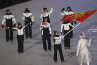 <p>Jelena Vujici carries the flag of Montenegro during the opening ceremony of the 2018 Winter Olympics in Pyeongchang, South Korea, Friday, Feb. 9, 2018. (AP Photo/Michael Sohn) </p>