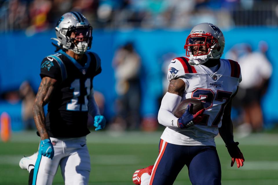 Patriots cornerback J.C. Jackson runs for a touchdown after an interception against the Panthers on Sunday.