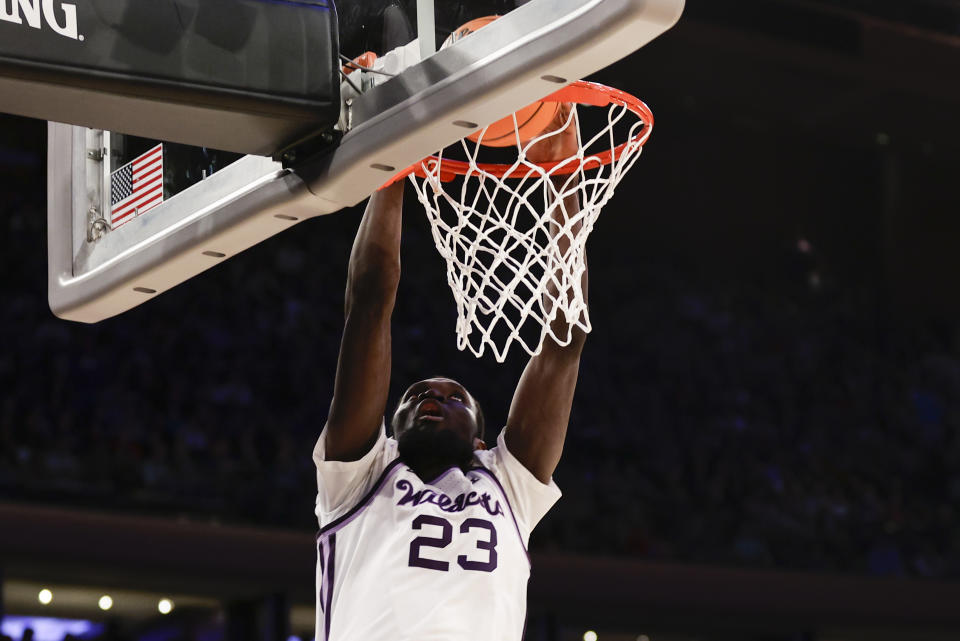 Kansas State's Abayomi Iyiola (23) dunks in the first half of an Elite 8 college basketball game against Florida Atlantic in the NCAA Tournament's East Region final, Saturday, March 25, 2023, in New York. (AP Photo/Adam Hunger)