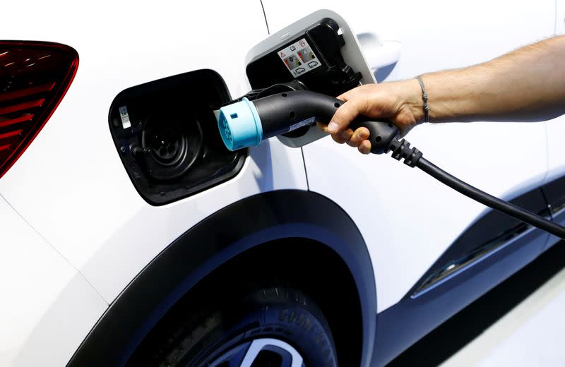 FILE PHOTO: The charging plug of a Renault Captur E-Tech Hybrid car is seen at Brussels Motor Show