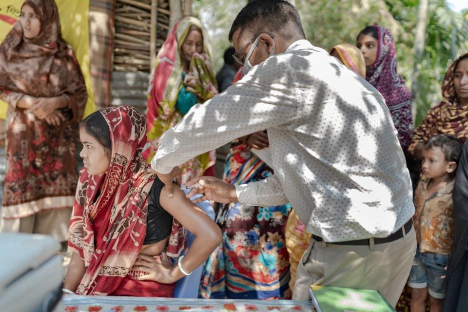 A young woman is vaccinated at a centre in Sylhet supported by Uncief (Unicef UK)