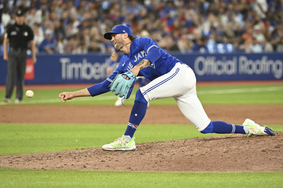 Toronto Blue Jays relief pitcher Adam Cimber throws to a Baltimore Orioles batter during the eighth inning of a baseball game Tuesday, Aug. 16, 2022, in Toronto. (Jon Blacker/The Canadian Press via AP)