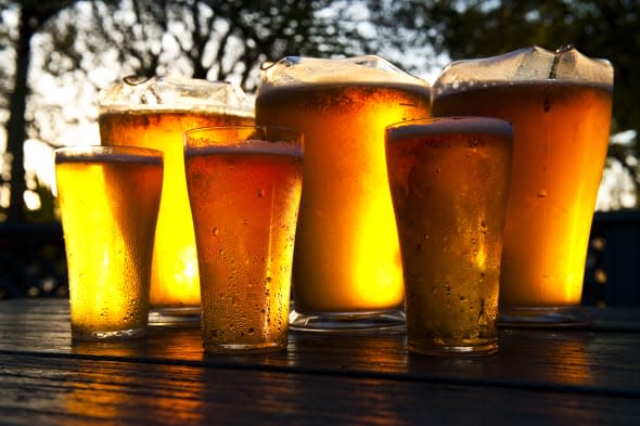 Frosty jugs of beer in summer sun.