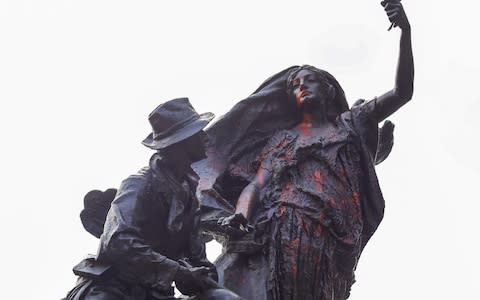 A Confederate statue in Piedmont Park is splattered with red paint after being vandalized in Atlanta, Georgia, USA, 15 August 2017 - Credit: EPA