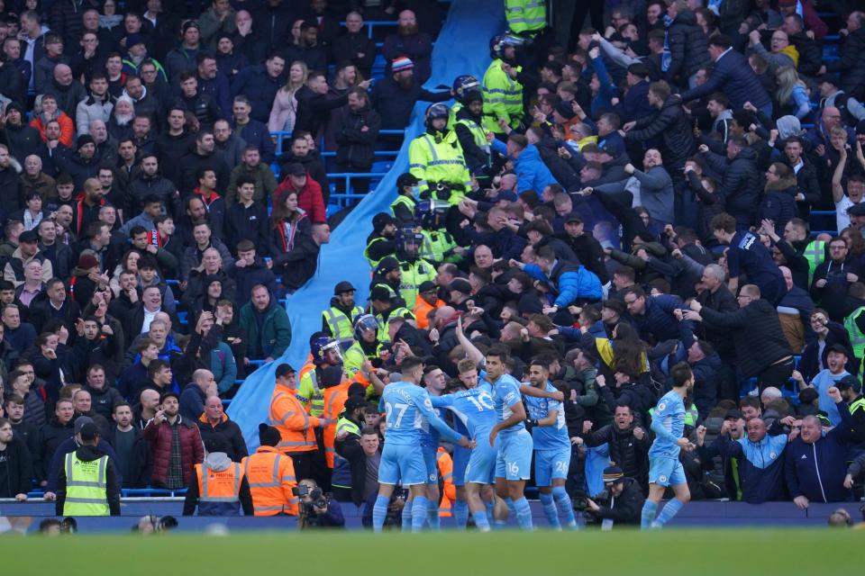 Manchester City's Kevin De Bruyne, center, celebrates after scoring his side's second goal during the English Premier League soccer match against Manchester United, at the Etihad stadium in Manchester, England, on March 6, 2022. Manchester City will play an exhibition game July 23 at Lambeau Field.