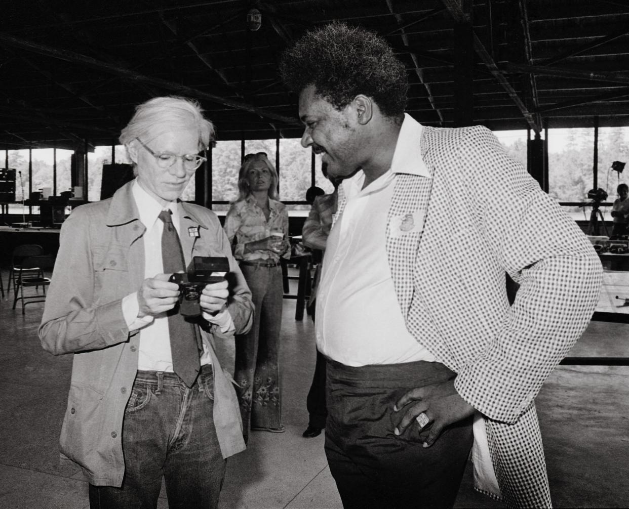 Andy Warhol and Don King at the 1976 Capricorn Records annual summer BBQ. (Credit: Herb Kossover/Getty Images)