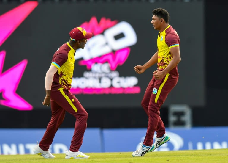 Gudakesh Motie, right, of the West Indies celebrates the dismissal of <a class="link " href="https://sports.yahoo.com/soccer/teams/england-women/" data-i13n="sec:content-canvas;subsec:anchor_text;elm:context_link" data-ylk="slk:England;sec:content-canvas;subsec:anchor_text;elm:context_link;itc:0">England</a>'s Phil Salt during the T20 match against the West Indies at Tarouba, Trinidad and Tobago (Randy Brooks)