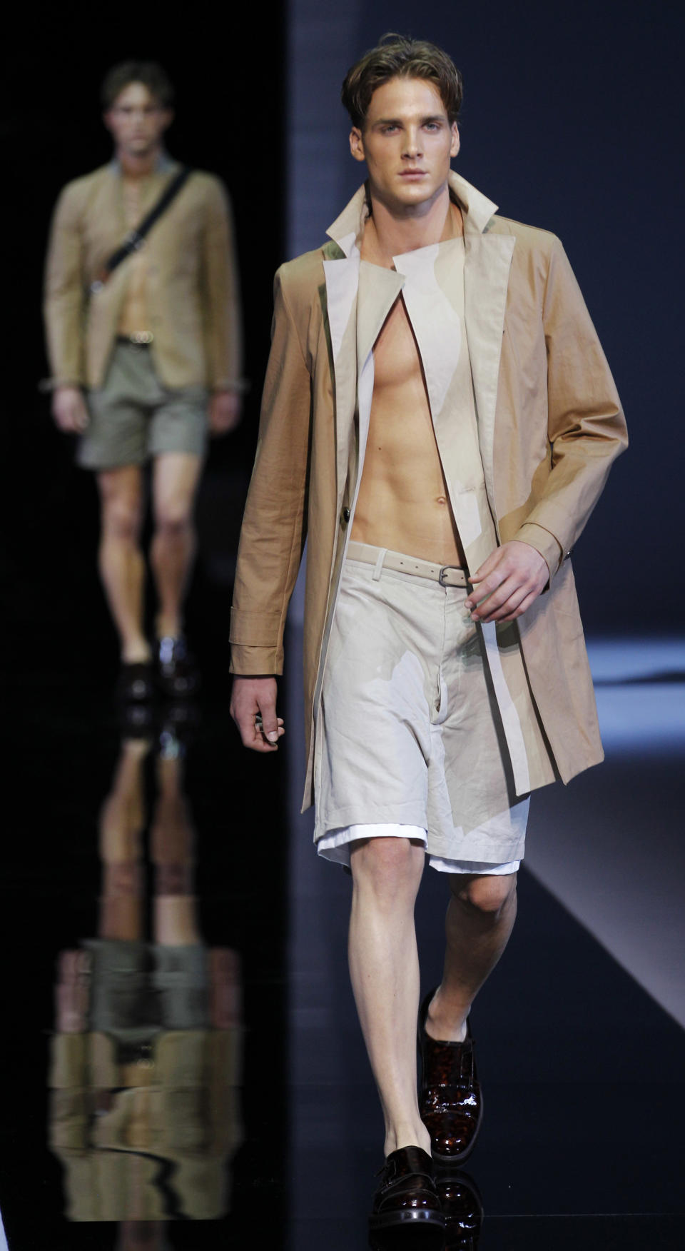 A model wears a creation of Emporio Armani, from the men's Spring-Summer 2013 collection, part of the Milan Fashion Week, unveiled in Milan, Italy, Monday, June 25, 2012. (AP Photo/Luca Bruno)