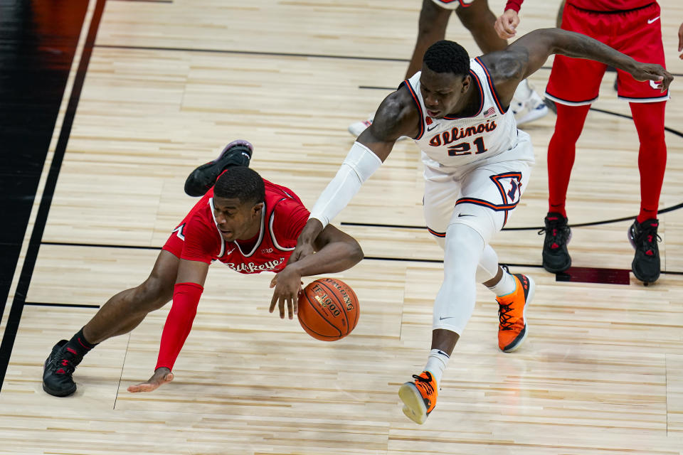 Ohio State forward E.J. Liddell (32) and Illinois center Kofi Cockburn (21) go for the ball during the second half of an NCAA college basketball championship game at the Big Ten Conference tournament, Sunday, March 14, 2021, in Indianapolis. (AP Photo/Michael Conroy)