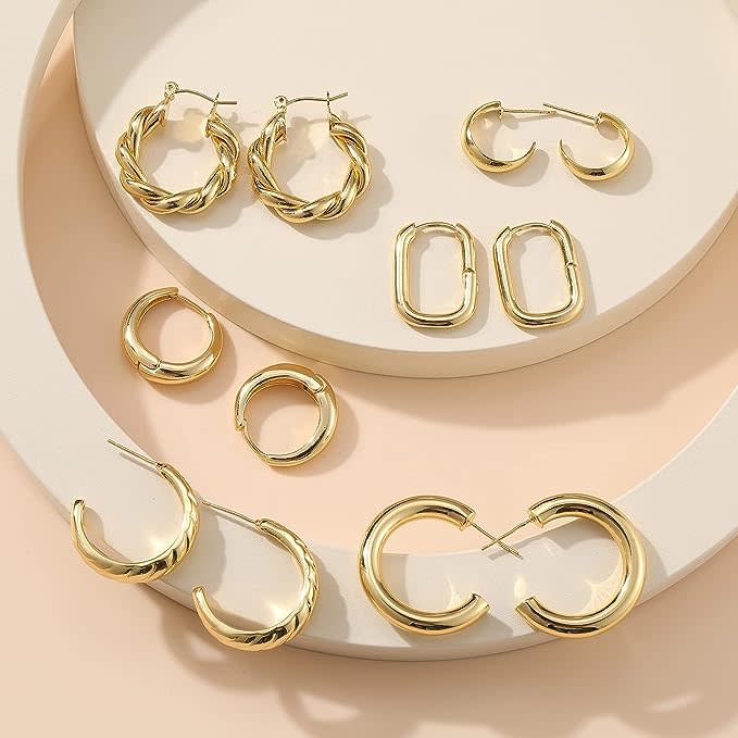 the gold earrings laid out