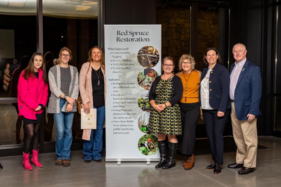 Mollie Gordon, Madeline Magin, Jessica Whitmire, Virginia Watkins, Dee Dee Perkins, and Larry Chapman, all with the Transylvania County Tourism Development Authority, join Southern Highlands Reserve Executive Director Kelly Holdbrooks in support of red spruce restoration.