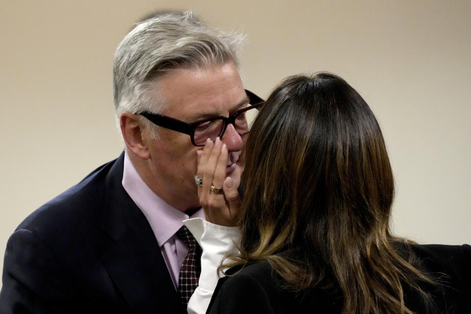 Actor Alec Baldwin interacts with wife Hilaria Baldwin during a break in his hearing in Santa Fe County District Court, Wednesday, July 10, 2024, in Santa Fe, N.M. Baldwin is facing a single charge of involuntary manslaughter in the death of a cinematographer. (AP Photo/Ross D. Franklin, Pool)