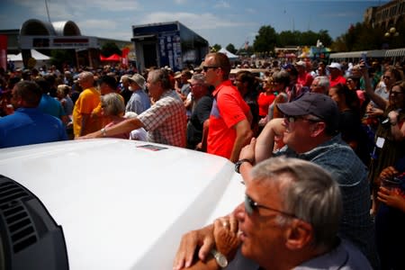 People listen as Democratic 2020 U.S. presidential candidate and former U.S. Vice President Joe Biden speaks at the Iowa State Fair in Des Moines