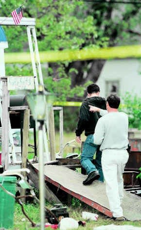 Detectives search the property in Linton belonging to Jerry Earl Russell in 1998, after he was charged in the death of Pamela Foddrill.