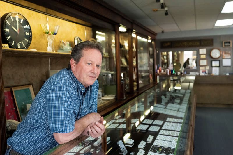 Gemologist Russ Ebert stands inside Russ' Jewelry, his jewelry store since 1988, in Norton