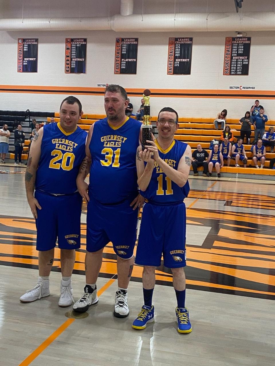 Guernsey Eagles players with their second-place trophy for the 3-on-3 tournament are, from left, DJ Hall, Robert Covington and Jason Hall.