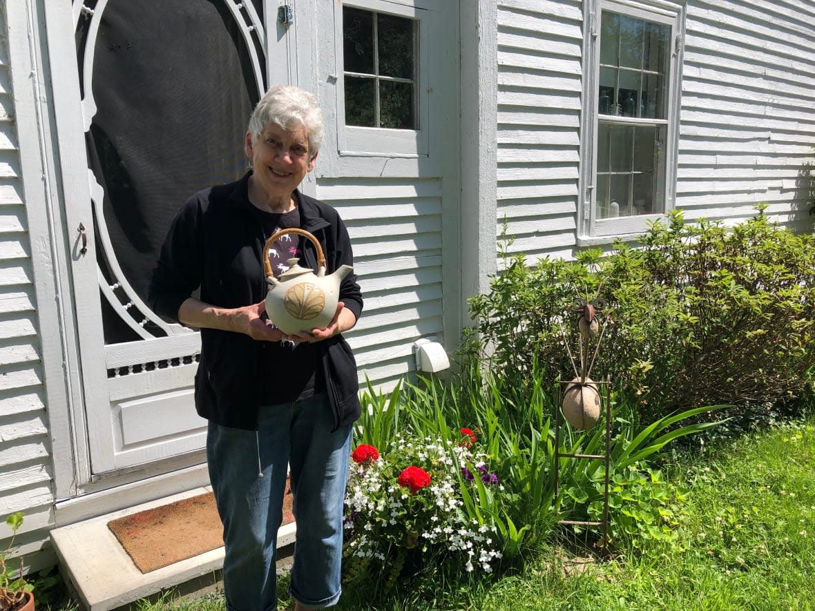 Joan Shaw has been crafting teapots, mugs, vases and one-of-a-kind pieces from her Fredericton home studio for more than 5 decades. (Jan Lakes/CBC - image credit)