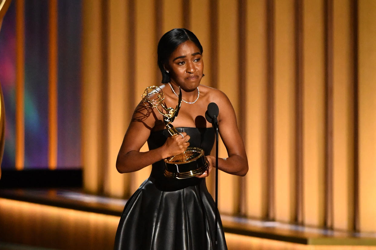 TOPSHOT - Outstanding Supporting Actress in a Comedy Series Ayo Edebiri, The Bear, accepts her award onstage during the 75th Emmy Awards at the Peacock Theatre at L.A. Live in Los Angeles on January 15, 2024. (Photo by Valerie Macon / AFP) (Photo by VALERIE MACON/AFP via Getty Images)