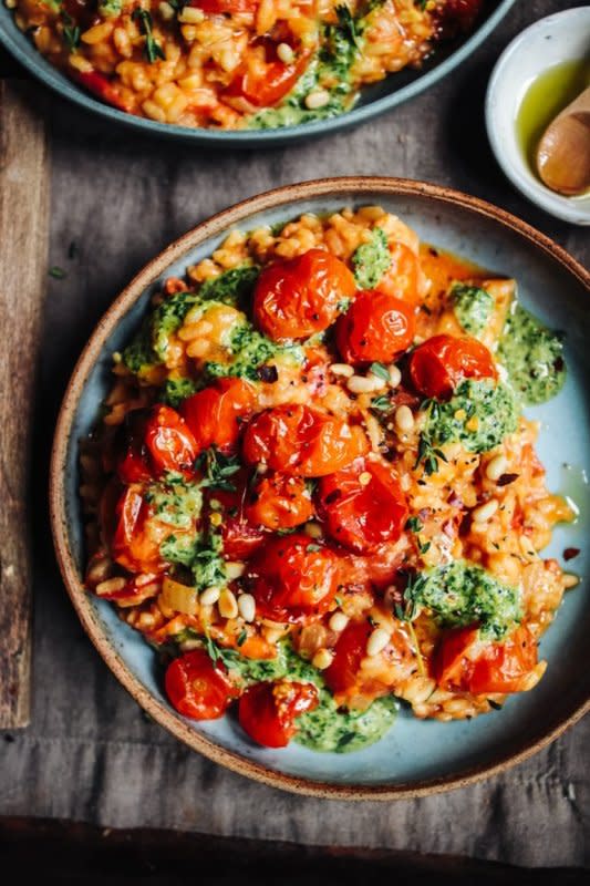 Rebel Recipes<p>This roast tomato and thyme risotto with basil pesto really is a celebration of beautiful seasonal tomatoes.</p><p><strong>Get the recipe: <a href="https://www.rebelrecipes.com/roast-cherry-tomato-and-thyme-risotto-with-basil-pesto/" rel="sponsored" target="_blank" data-ylk="slk:Roast Cherry Tomato and Thyme Risotto with Basil Pesto;elm:context_link;itc:0;sec:content-canvas" class="link "><em>Roast Cherry Tomato and Thyme Risotto with Basil Pesto</em></a></strong></p>