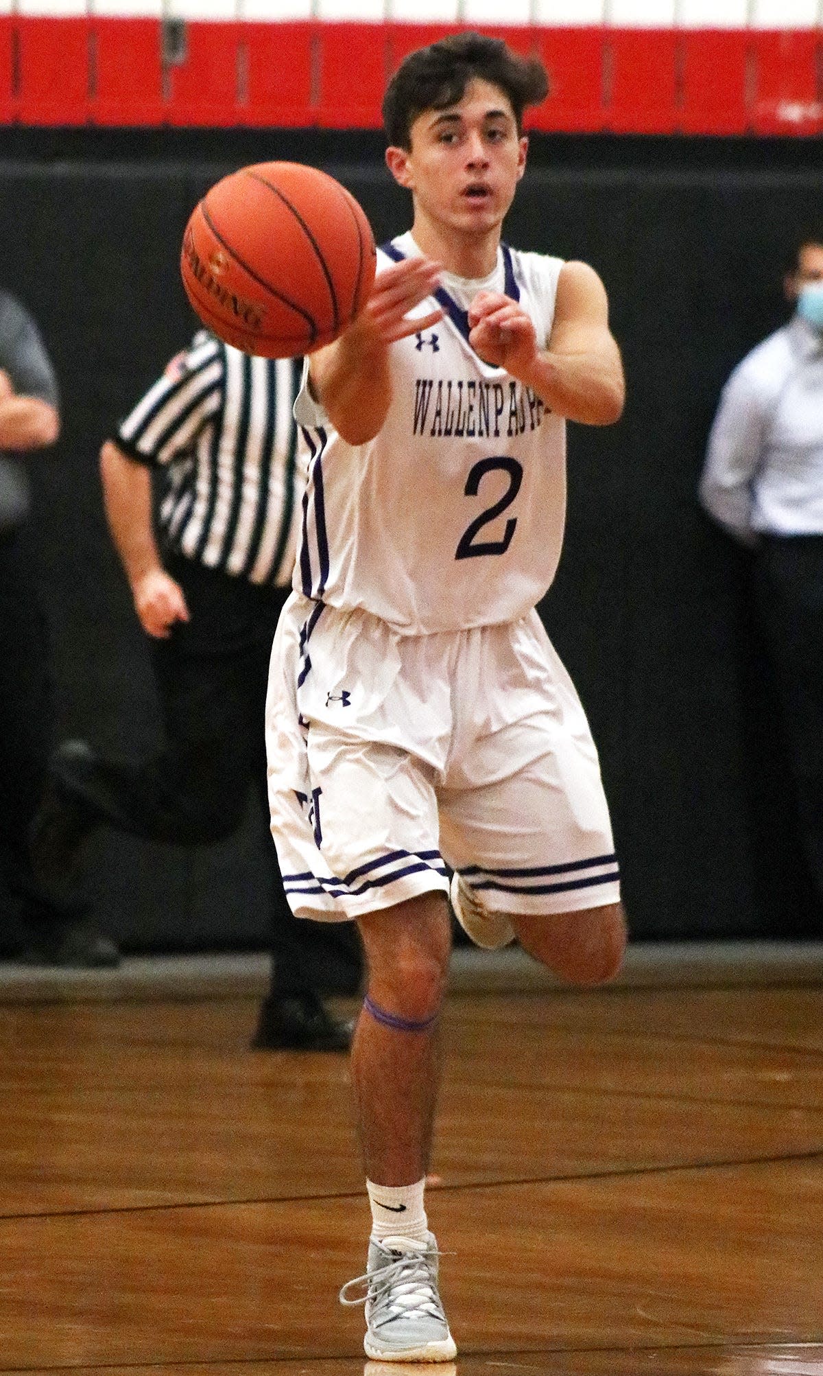 Wallenpaupack Area guard Jack Smith unleashes a bullet pass during recent Lackawanna League boys varsity basketball action at Honesdale.