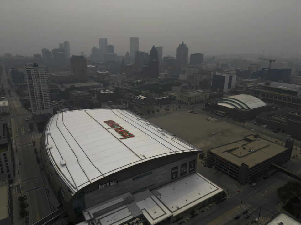 A haze from Canadian wildfires hangs over Milwaukee, Tuesday, June 27, 2023. The haze from Canadian wildfires, which, along with higher ozone levels is continuing to create low visibility conditions and lead to air quality alerts throughout the area. (AP Photo/Morry Gash)