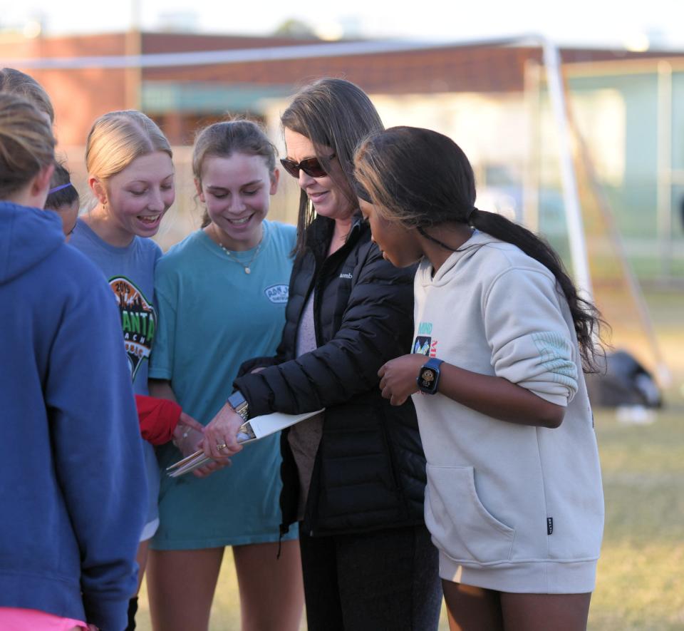 Effingham County High School interim girls soccer head coach Tara Aiken gives instructions to players.
