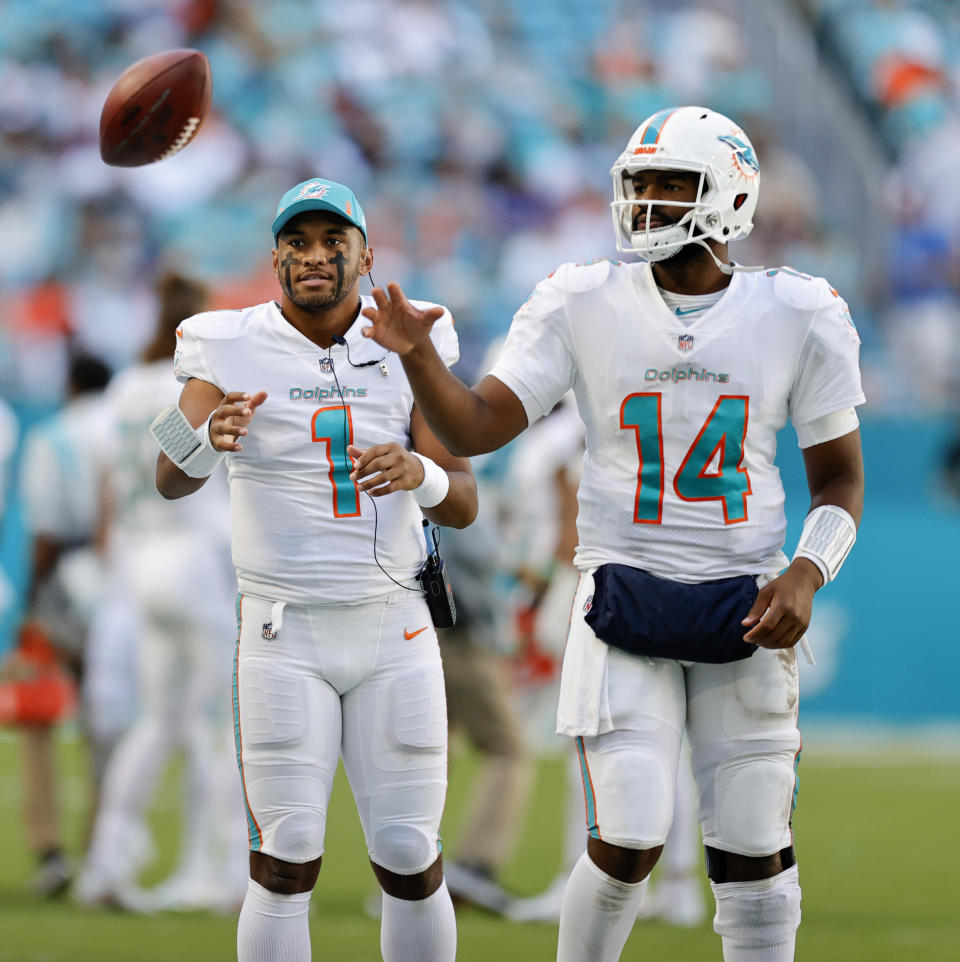 Miami Dolphins quarterbacks Tua Tagovailoa (1) and Jacoby Brissett (14) during second quarter of an NFL football game against the Houston Texans at Hard Rock Stadium on Sunday, November 7, 2021 in Miami Gardens, Fla. (David Santiago/Miami Herald via AP)