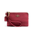 <p>Coach Corner Zip Wristlet in Lacquer Rivets Pebble Leather, $85, <a href="http://www.coach.com/coach-designer-wristlets-corner-zip-wristlet-in-lacquer-rivets-pebble-leather/64252.html?dwvar_color=LIBCY&cgid=women-wristlets" rel="nofollow noopener" target="_blank" data-ylk="slk:coach.com;elm:context_link;itc:0;sec:content-canvas" class="link ">coach.com</a> </p>