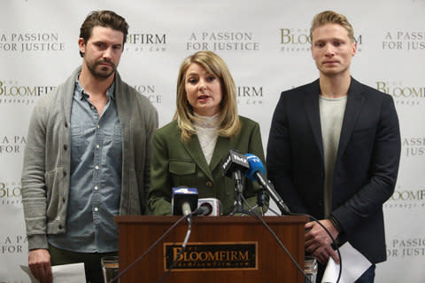 Lawyer Lisa Bloom speaks at a press conference with clients, models Mark Ricketson (L) and Jason Boyce (R), both accusing Bruce Weber of sexual misconduct - Credit: Getty