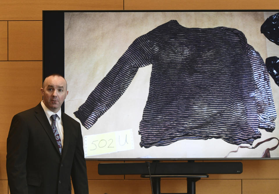 Connecticut State Police Sgt. Kevin Duggan shows a blood-like stain found on a women's long-sleeve shirt seized from a trash can on Albany Avenue in Hartford on day eight of Michelle Troconis' criminal trial at Connecticut Superior Court in Stamford, Conn. Tuesday, Jan. 23, 2024. Troconis is on trial for charges related to the disappearance and death of New Canaan resident Jennifer Dulos. (Tyler Sizemore/Hearst Connecticut Media via AP, Pool)