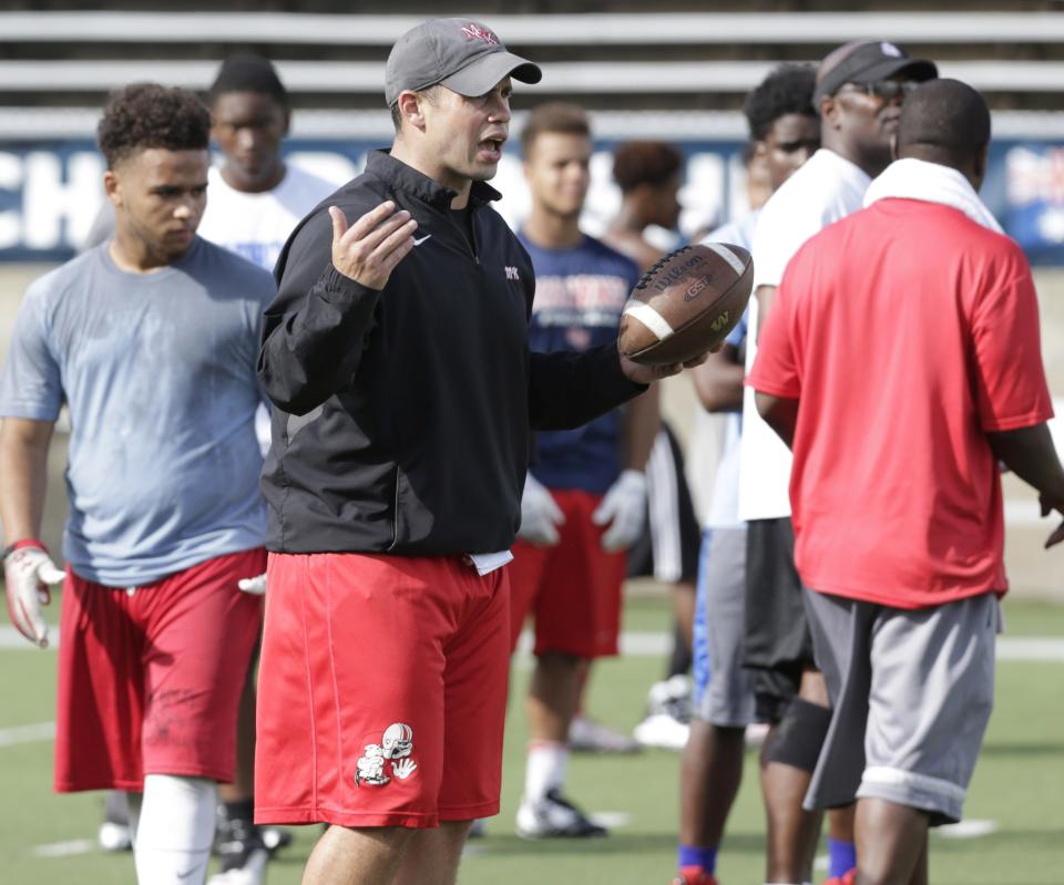 Josh Grimsley, shown here in a 2015 photo, had been an assistant football coach at McKinley High School for more than 15 years. Through a negotiated agreement with the school district, Grimsley has returned to his noncoaching job and could seek a coaching position as early as next school year.